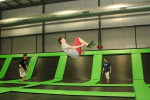 Boy Doing Backflip on Trampoline